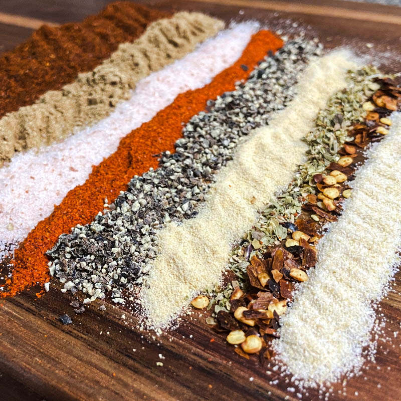 Homemade taco seasoning mix with spices like chili powder, oregano, garlic powder, and salt.